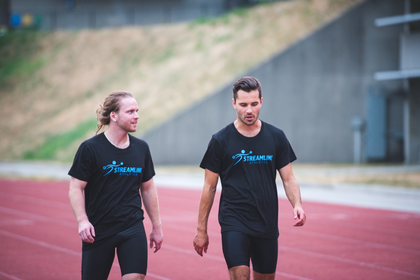 Alexandre Paré and Brett Montrose on the track in Streamline Athletes shirts, 2017