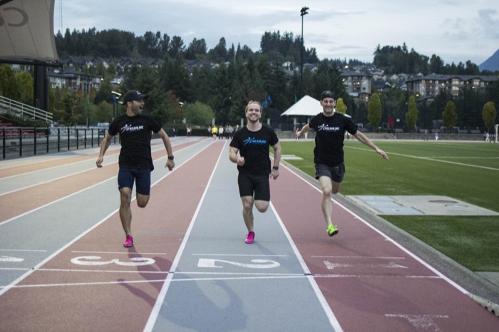 Brett Montrose, Alexandre Paré and Keir Forster running on the track in Streamline Athletes shirts, 2018